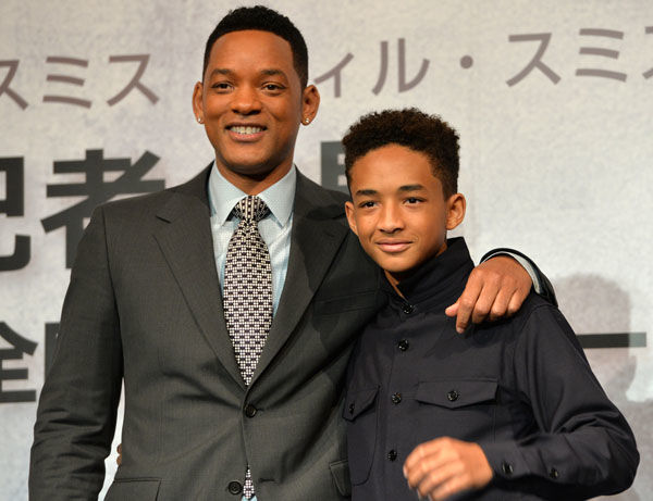 US actor Will Smith (L) and his son Jaden Smith (R) smile for photos after their press conference of their new movie "After Earth" in Tokyo on May 2, 2013. The movie will be screaning in Japan on June 21. AFP PHOTO / Yoshikazu TSUNO (Photo credit should read YOSHIKAZU TSUNO/AFP/Getty Images)